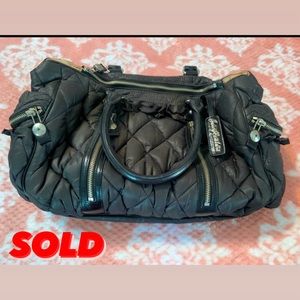 Gray Nylon/wind breaker material Juicy Couture bag.